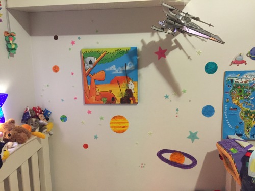 My son's bedroom wall with stars and planets
